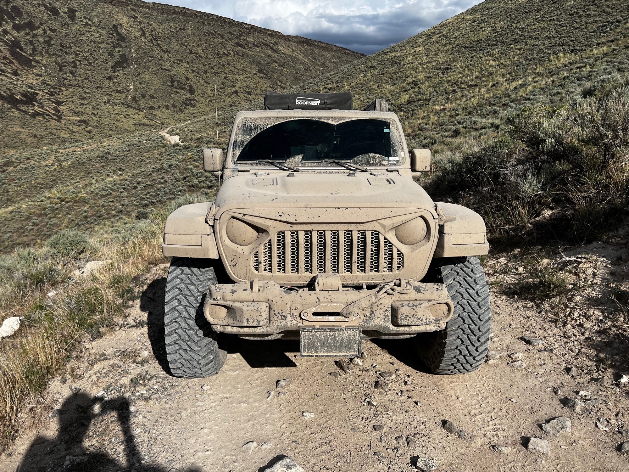 A Jeep on a rough track in dry mountain country